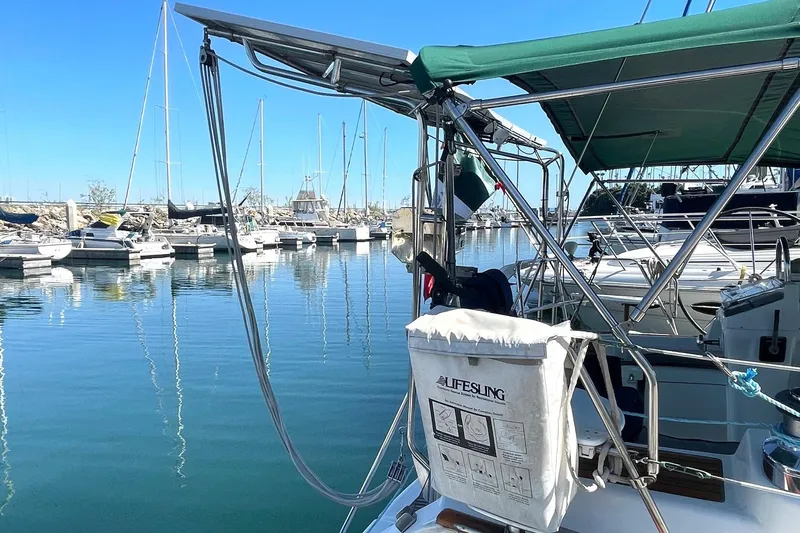 Slide: The Image of Sailboat Beneteau 423 (2007) docked in marina with lifesling visible. - 4