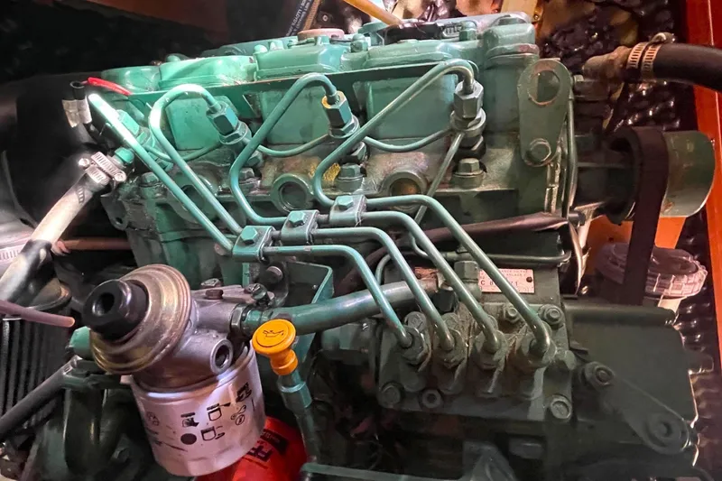 Slide: The Image of Engine of a 2007 Beneteau 423 sailboat, showcasing intricate mechanical components. - 40