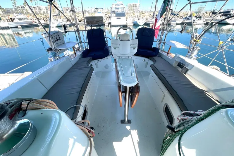 Slide: The Image of Spacious cockpit of a 2007 Beneteau 423 sailboat docked in a marina. - 44