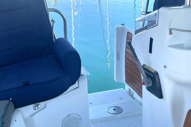 Slide: The Image of 2007 Beneteau 423 yacht cockpit with blue seating and wooden accents. - 45