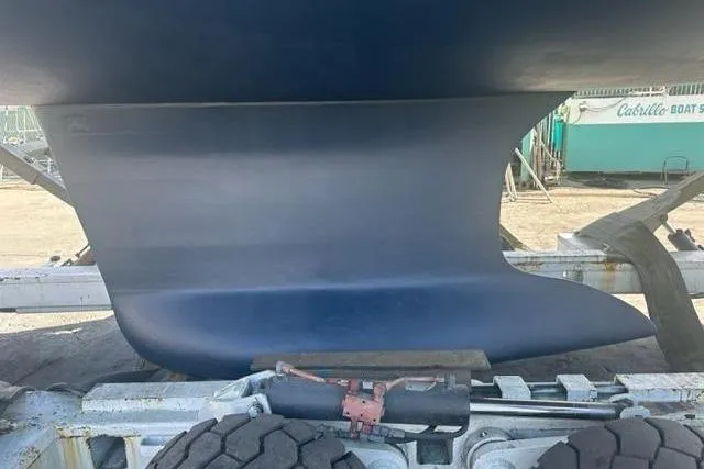 Slide: The Image of 2007 Beneteau 423 sailboat keel on trailer at boatyard. - 49