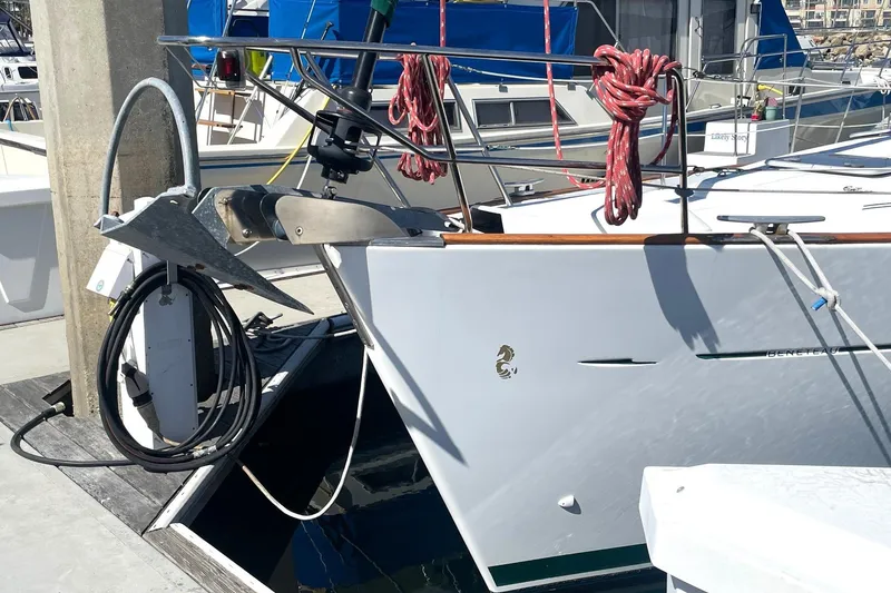 Slide: The Image of 2007 Beneteau 423 yacht docked, featuring anchor and coiled ropes. - 5