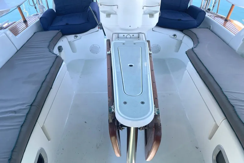 Slide: The Image of Spacious cockpit of 2007 Beneteau 423 sailboat with cushioned seating and central table. - 9