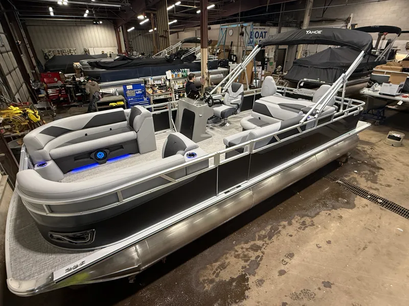 The Image of 2026 Tahoe Sport 2385 Tritoon indoors, gray upholstery, modern features. - 1