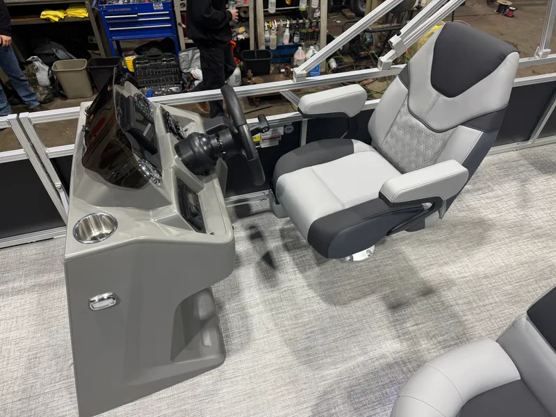 Slide: The Image of Interior of 2026 Tahoe Sport 2385 Tritoon with console and seating. - 10
