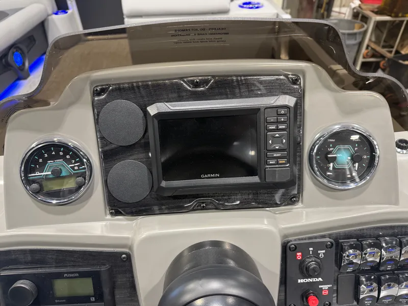 Slide: The Image of Dashboard of Tahoe Sport 2385 Tritoon with Garmin navigation. - 14