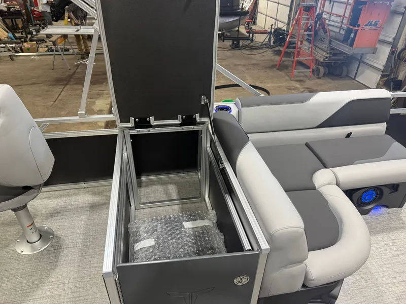 Slide: The Image of Interior of Tahoe Sport 2385 Tritoon with seating and storage compartment. - 18