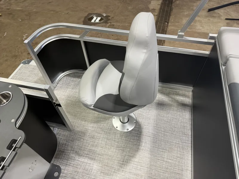 Slide: The Image of 2026 Tahoe Sport 2385 Tritoon seating area with gray upholstery. - 20