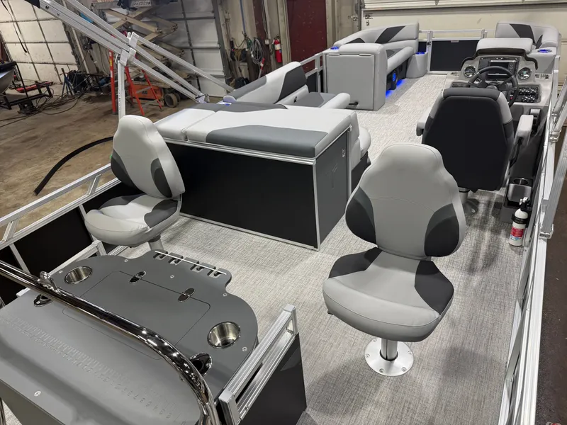 Slide: The Image of Interior of 2026 Tahoe Sport 2385 Tritoon with modern seating. - 24