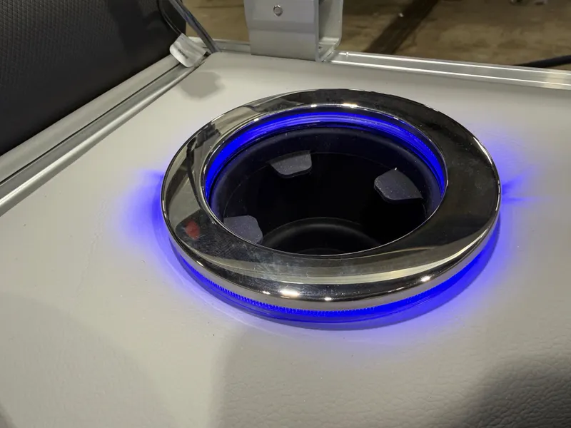 Slide: The Image of Illuminated cup holder on Tahoe Sport 2385 Tritoon, 2026 model. - 26