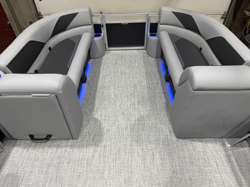 Slide: The Image of Interior of Tahoe Sport 2385 Tritoon with gray seating and blue lighting. - 32