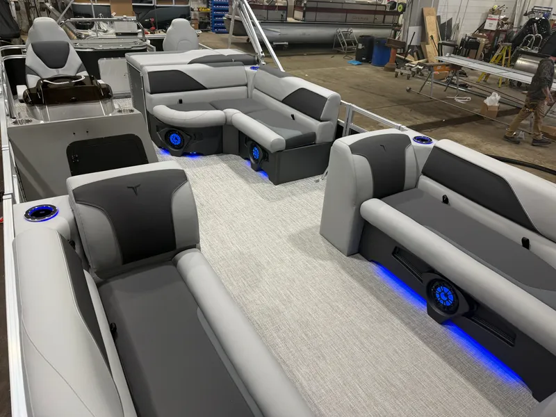 Slide: The Image of Interior of Tahoe Sport 2385 Tritoon with blue LED lighting, 2026 model. - 34