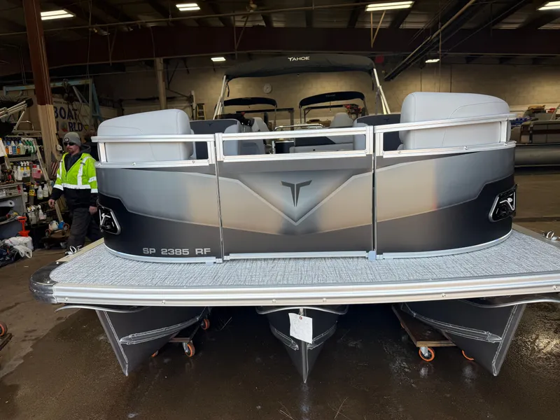 Slide: The Image of 2026 Tahoe Sport 2385 Tritoon in indoor setting. - 35