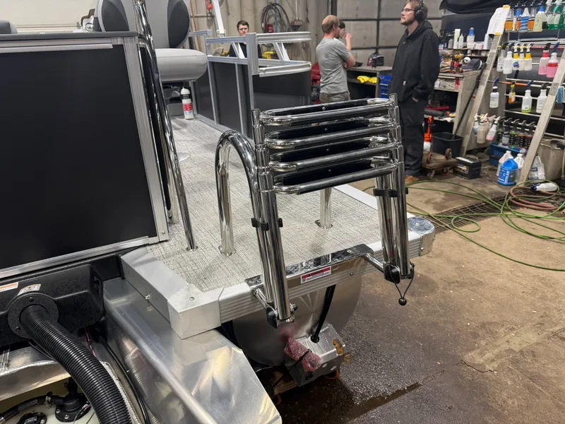 Slide: The Image of 2026 Tahoe Sport 2385 Tritoon with ladder in workshop. - 44