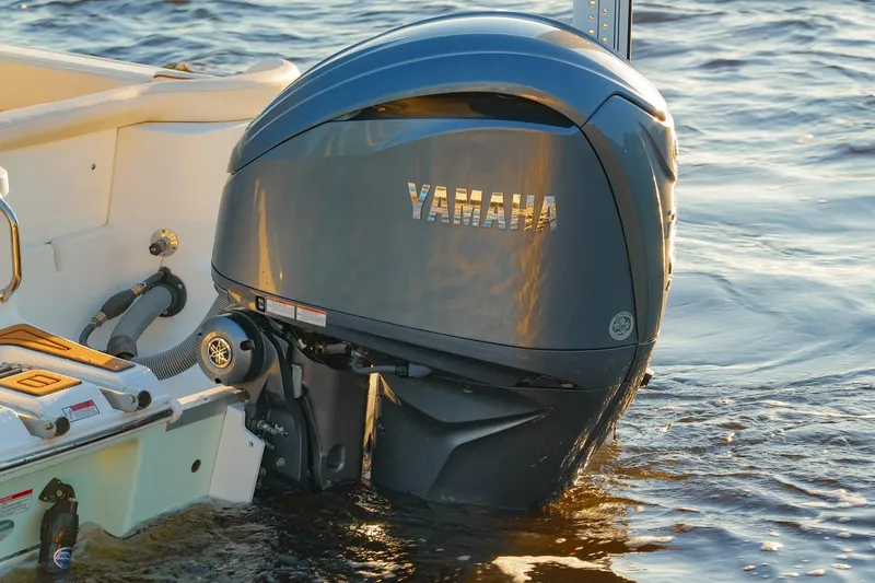 Slide: The Image of 2022 Sea Hunt Ultra 229 with Yamaha outboard motor on water. - 14