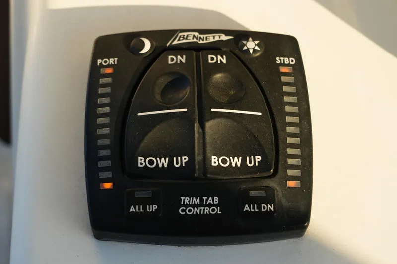 Slide: The Image of Bennett trim tab control panel on a 2022 Sea Hunt Ultra 229 boat. - 5