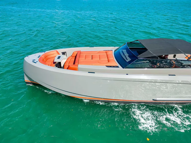 Slide: The Image of Vanquish Yachts VQ 45, 2021 model, cruising on turquoise water with sleek design. - 16