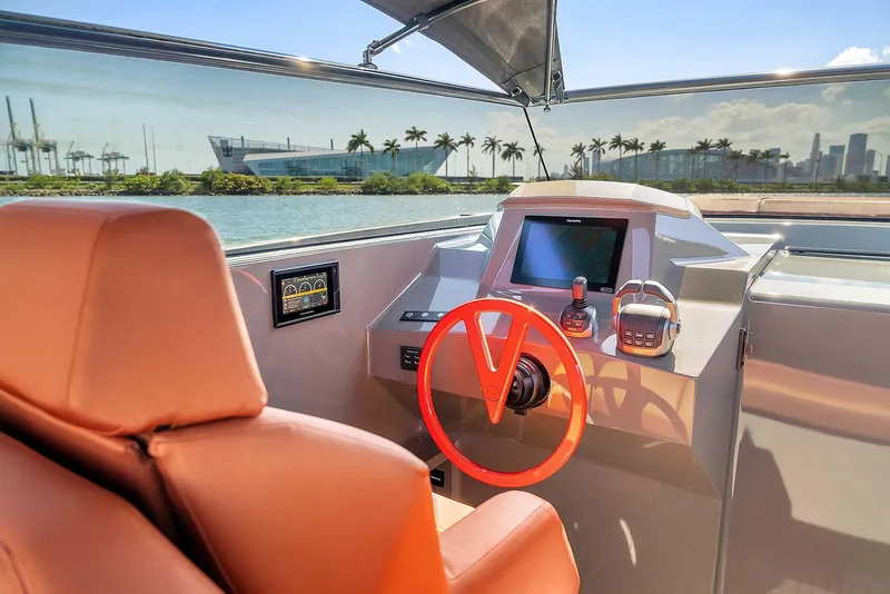 Slide: The Image of Interior of 2021 Vanquish Yachts VQ 45, featuring modern helm and luxurious seating. - 22
