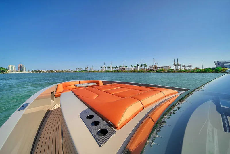 Slide: The Image of Vanquish Yachts VQ 45, 2021 model, luxury yacht on water with orange seating. - 30
