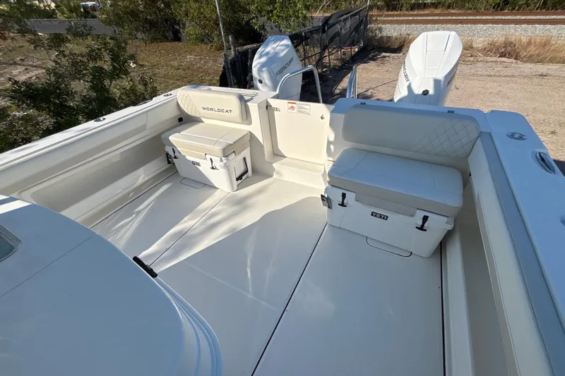 Slide: The Image of 2026 World Cat 325 CC boat interior with seating and storage compartments. - 12