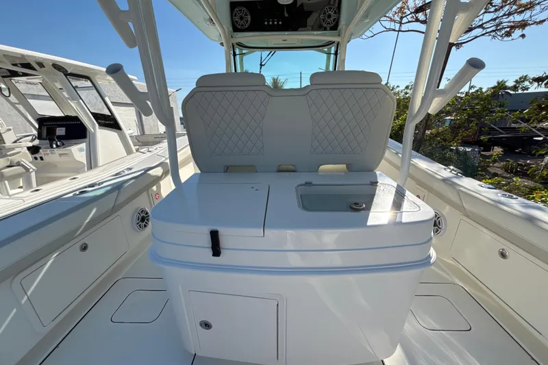 Slide: The Image of 2026 World Cat 325 CC boat interior with seating and storage compartments. - 13