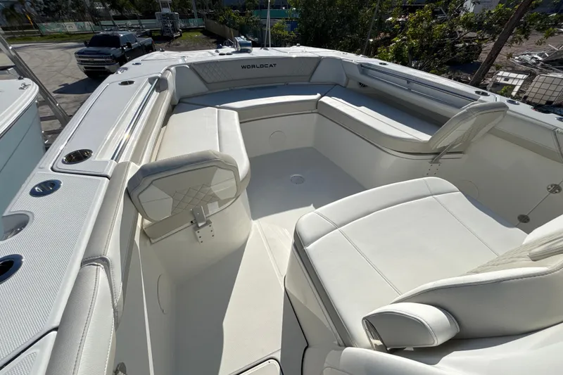Slide: The Image of 2026 World Cat 325 CC boat interior with white seating and modern design. - 5