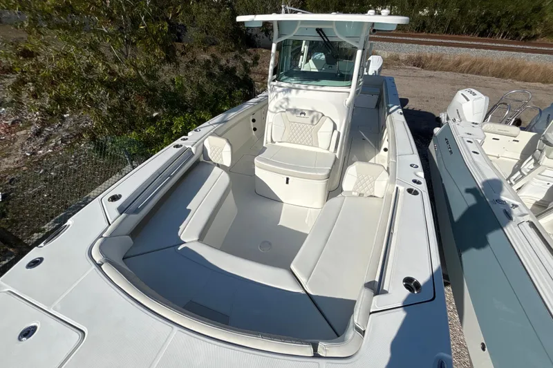 Slide: The Image of 2026 World Cat 325 CC boat with spacious seating and modern design. - 6