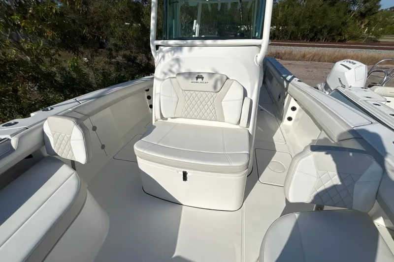 Slide: The Image of 2026 World Cat 325 CC boat interior with white seating and modern design. - 8
