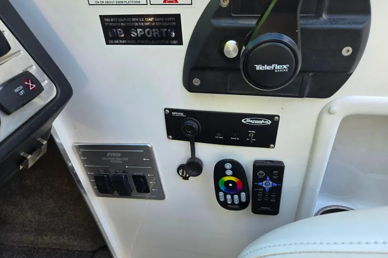Slide: The Image of Control panel of a 2010 MB SPORTS 21 Tomcat boat with Teleflex Marine throttle. - 11