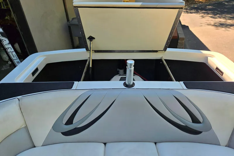 Slide: The Image of 2010 MB SPORTS 21 Tomcat boat interior with open engine compartment. - 16