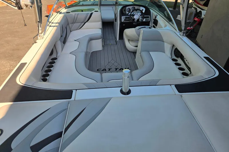 Slide: The Image of 2010 MB SPORTS 21 Tomcat boat interior with sleek seating and modern dashboard. - 5