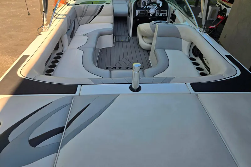Slide: The Image of 2010 MB SPORTS 21 Tomcat boat interior with sleek seating and modern dashboard. - 6