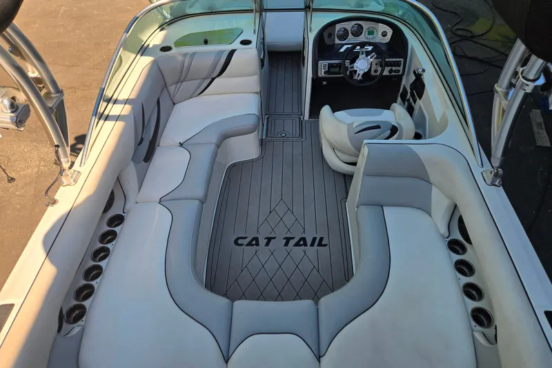 Slide: The Image of Interior of a 2010 MB SPORTS 21 Tomcat boat with sleek seating and modern dashboard. - 8