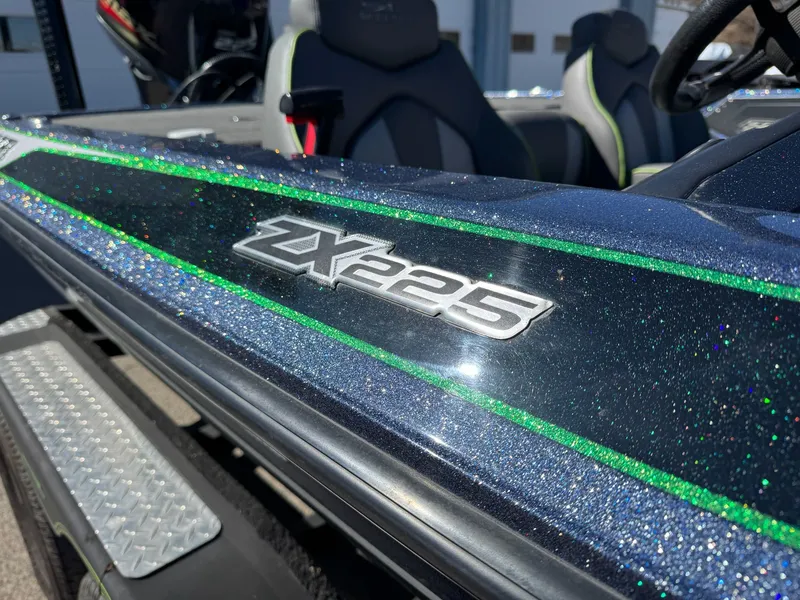 Slide: The Image of Close-up of a 2019 Skeeter ZX225 boat with glittering finish. - 10
