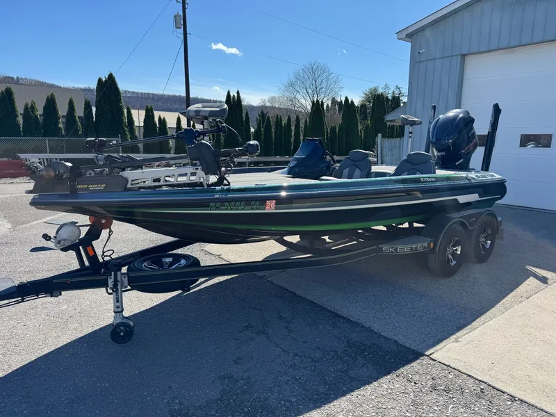 Slide: The Image of 2019 Skeeter ZX225 bass boat parked outdoors on trailer. - 20