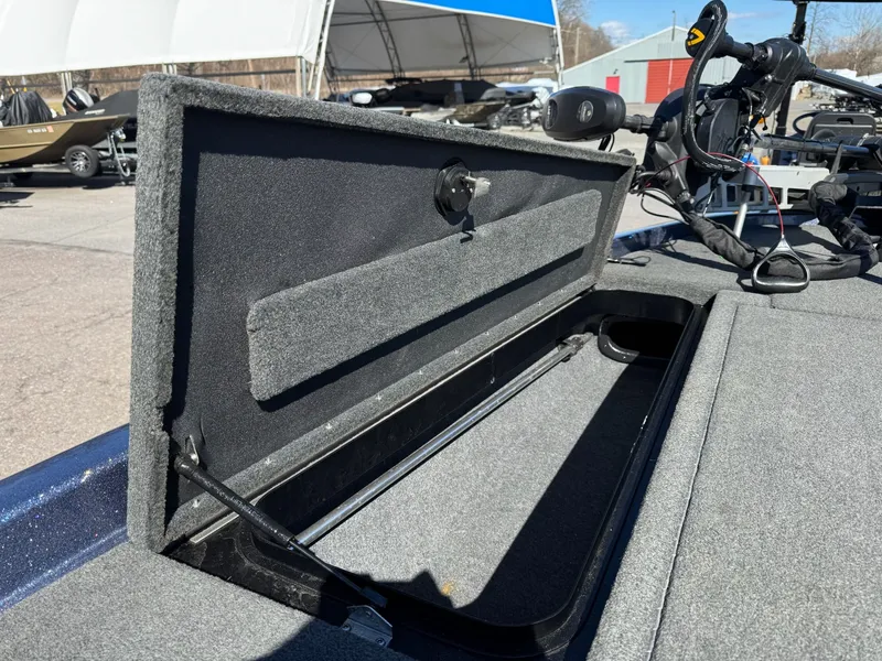 Slide: The Image of 2019 Skeeter ZX225 boat with open storage compartment on deck. - 25
