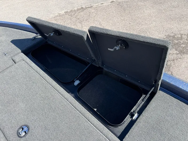 Slide: The Image of Open storage compartments on a 2019 Skeeter ZX225 boat. - 28