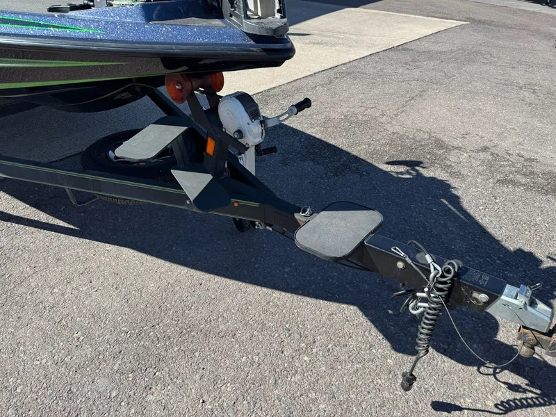 Slide: The Image of Trailer of a 2019 Skeeter ZX225 boat on asphalt. - 3