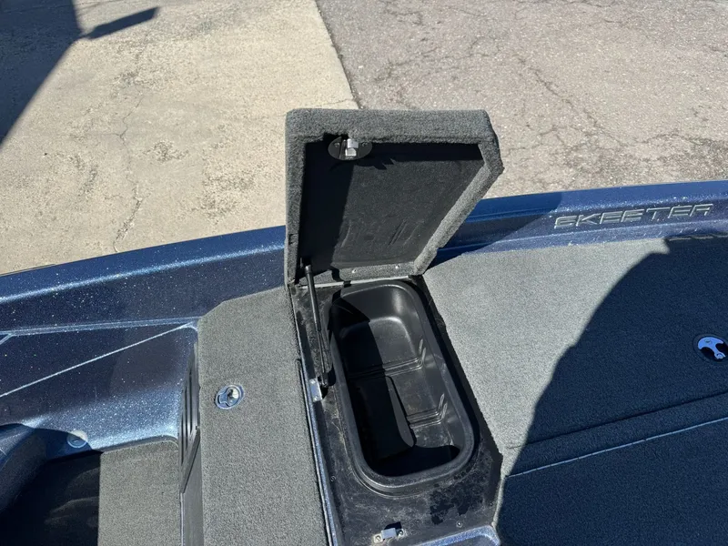 Slide: The Image of Open storage compartment on a 2019 Skeeter ZX225 boat. - 34