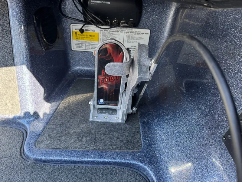 Slide: The Image of Interior of a 2019 Skeeter ZX225 boat with controls and sticker. - 36