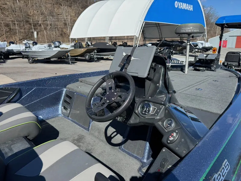 Slide: The Image of Interior of a 2019 Skeeter ZX225 boat with steering console. - 37