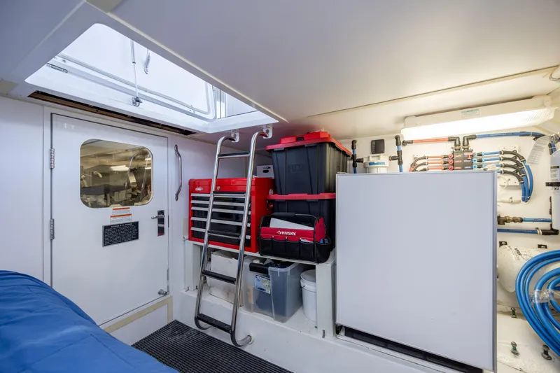 Slide: The Image of Engine room of 2008 Hatteras 64 Motor Yacht with tools and equipment. - 107