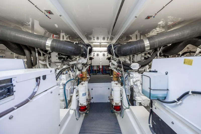 Slide: The Image of Engine room of 2008 Hatteras 64 Motor Yacht, showcasing mechanical components and systems. - 112