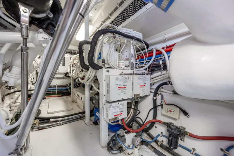 Slide: The Image of Engine room of 2008 Hatteras 64 Motor Yacht with complex wiring and machinery. - 115