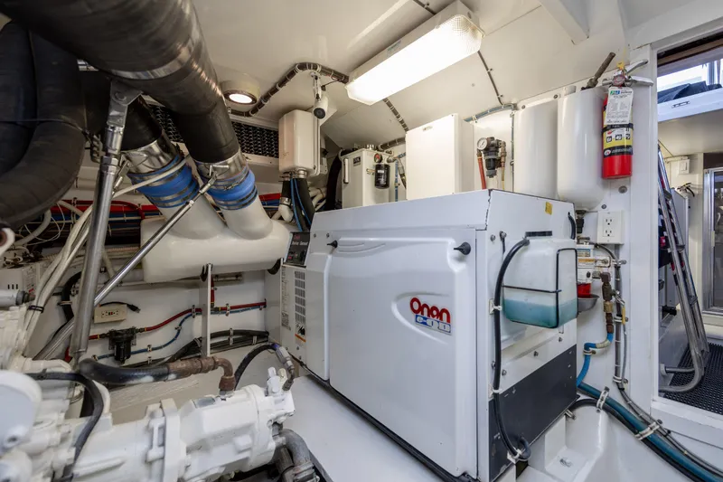 Slide: The Image of Engine room of 2008 Hatteras 64 Motor Yacht with Onan generator and equipment. - 126