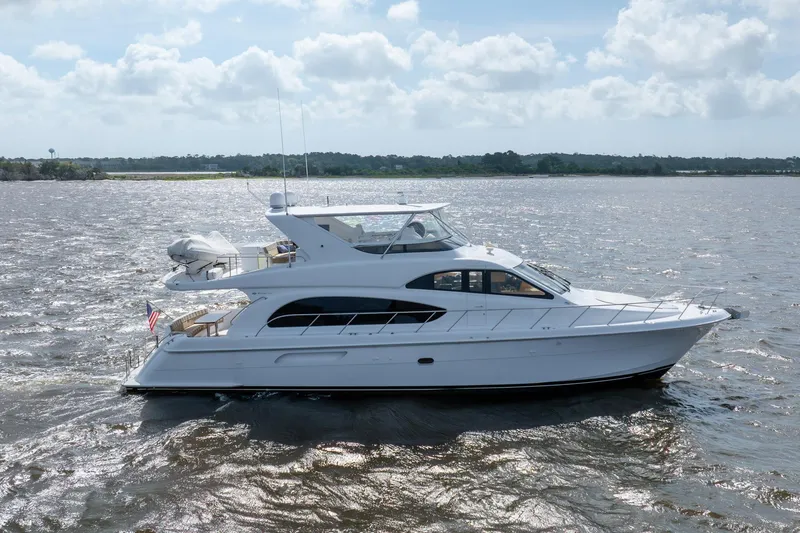 Slide: The Image of 2008 Hatteras 64 Motor Yacht cruising on a sunny day, side view. - 13