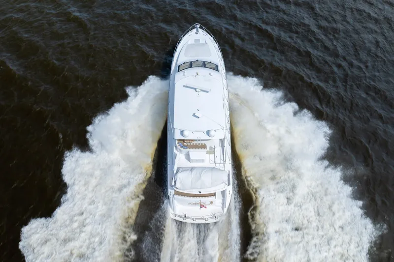 Slide: The Image of Aerial view of 2008 Hatteras 64 Motor Yacht cruising on water. - 27