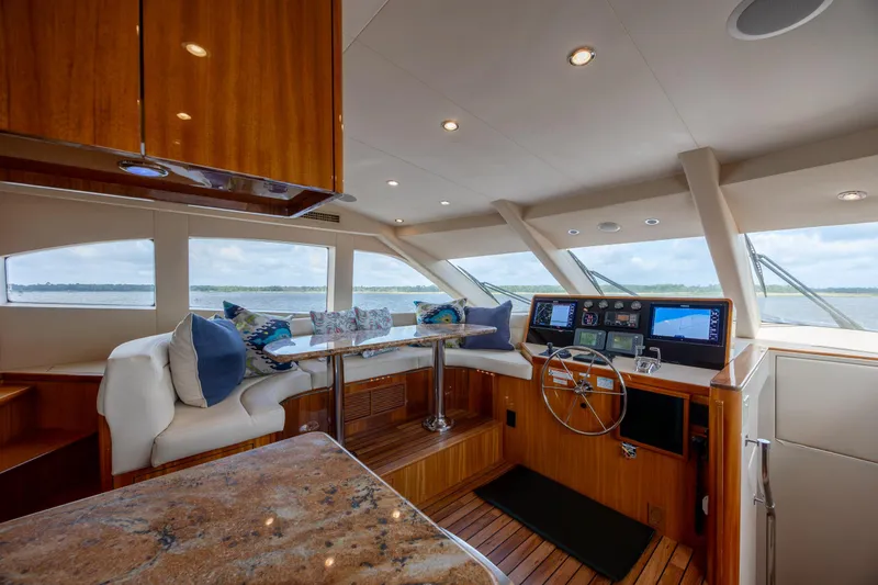Slide: The Image of Luxurious interior of 2008 Hatteras 64 Motor Yacht with plush seating and modern helm. - 33