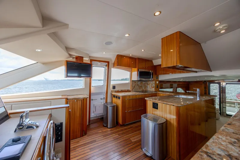 Slide: The Image of Luxurious interior of 2008 Hatteras 64 Motor Yacht with modern kitchen and ocean view. - 34