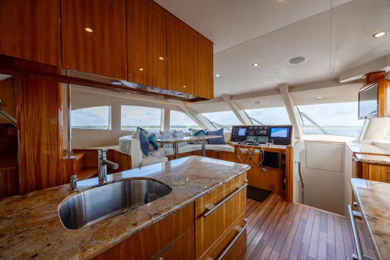 Slide: The Image of Luxurious interior of 2008 Hatteras 64 Motor Yacht with modern kitchen and helm. - 40